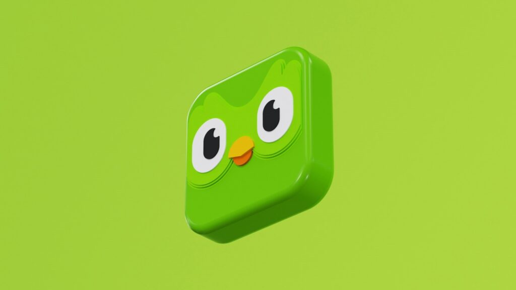 Groen 3D-logo van Duolingo met het uilengezicht prominent op een egaal groene achtergrond